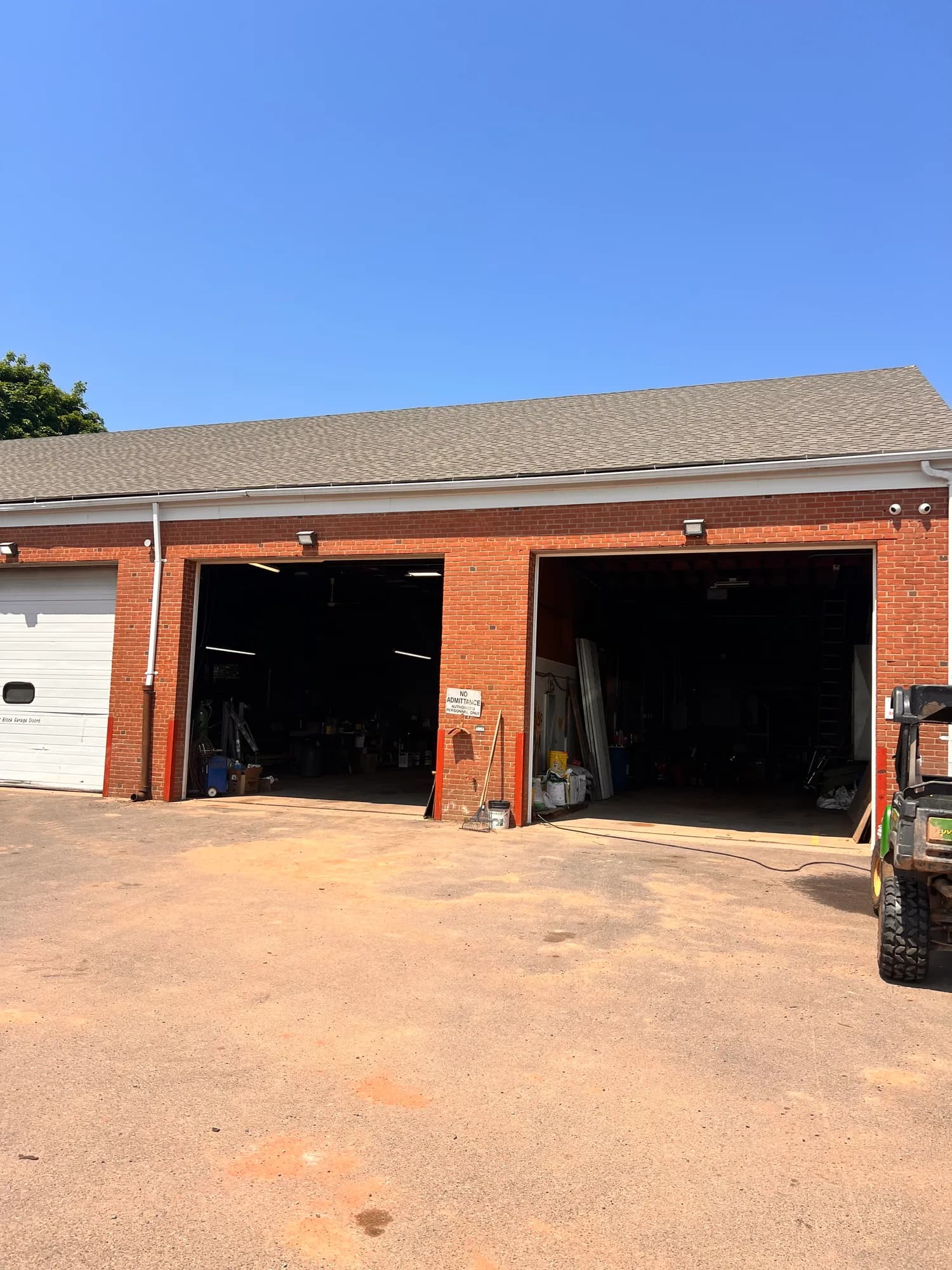 Brick commercial building with garage bays