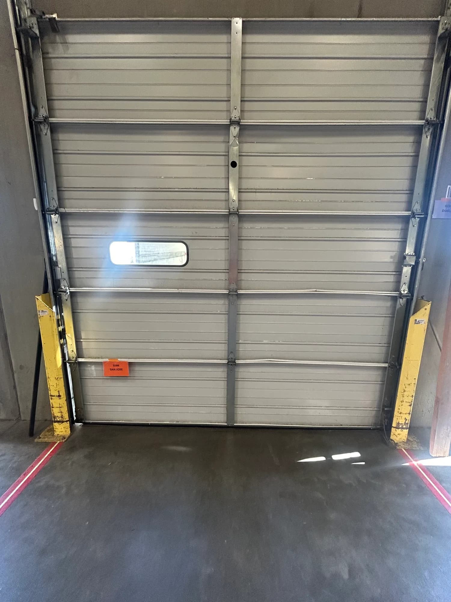White commercial sectional garage door