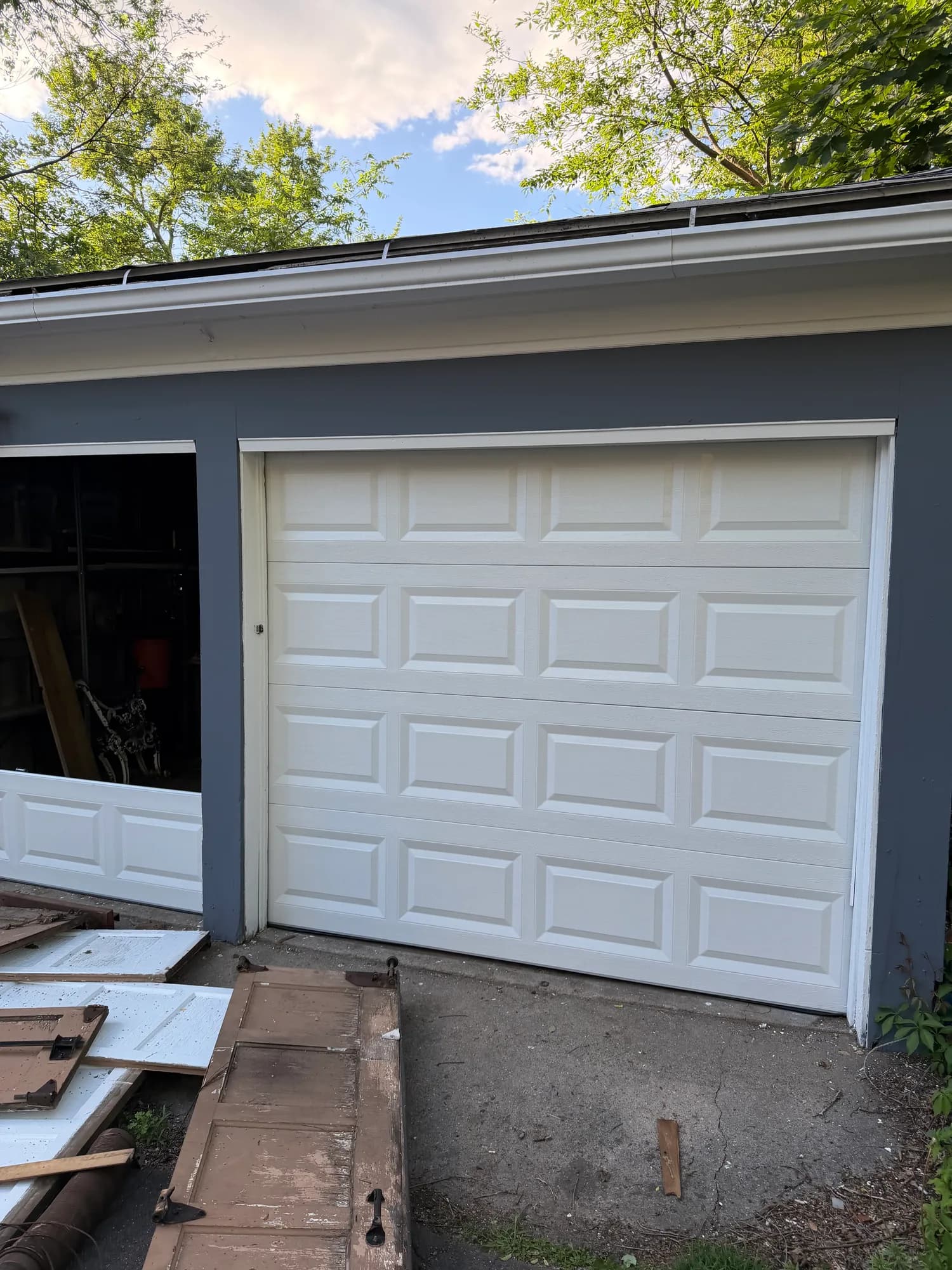Newly installed white double garage doors