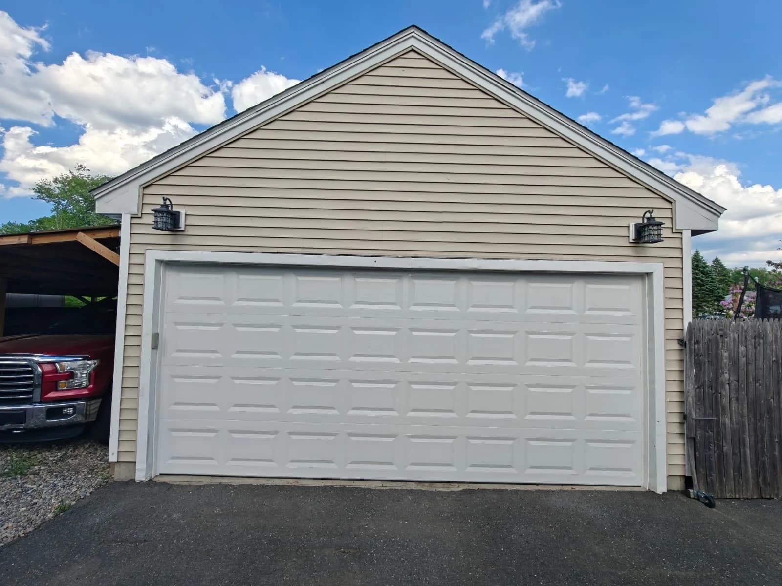 White sectional garage door on a house exterior