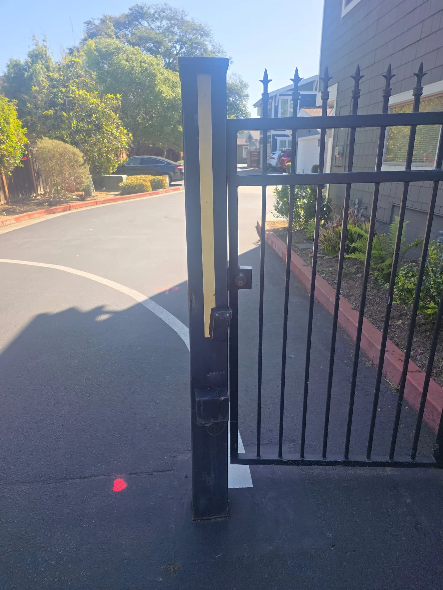 Black wrought iron driveway gate