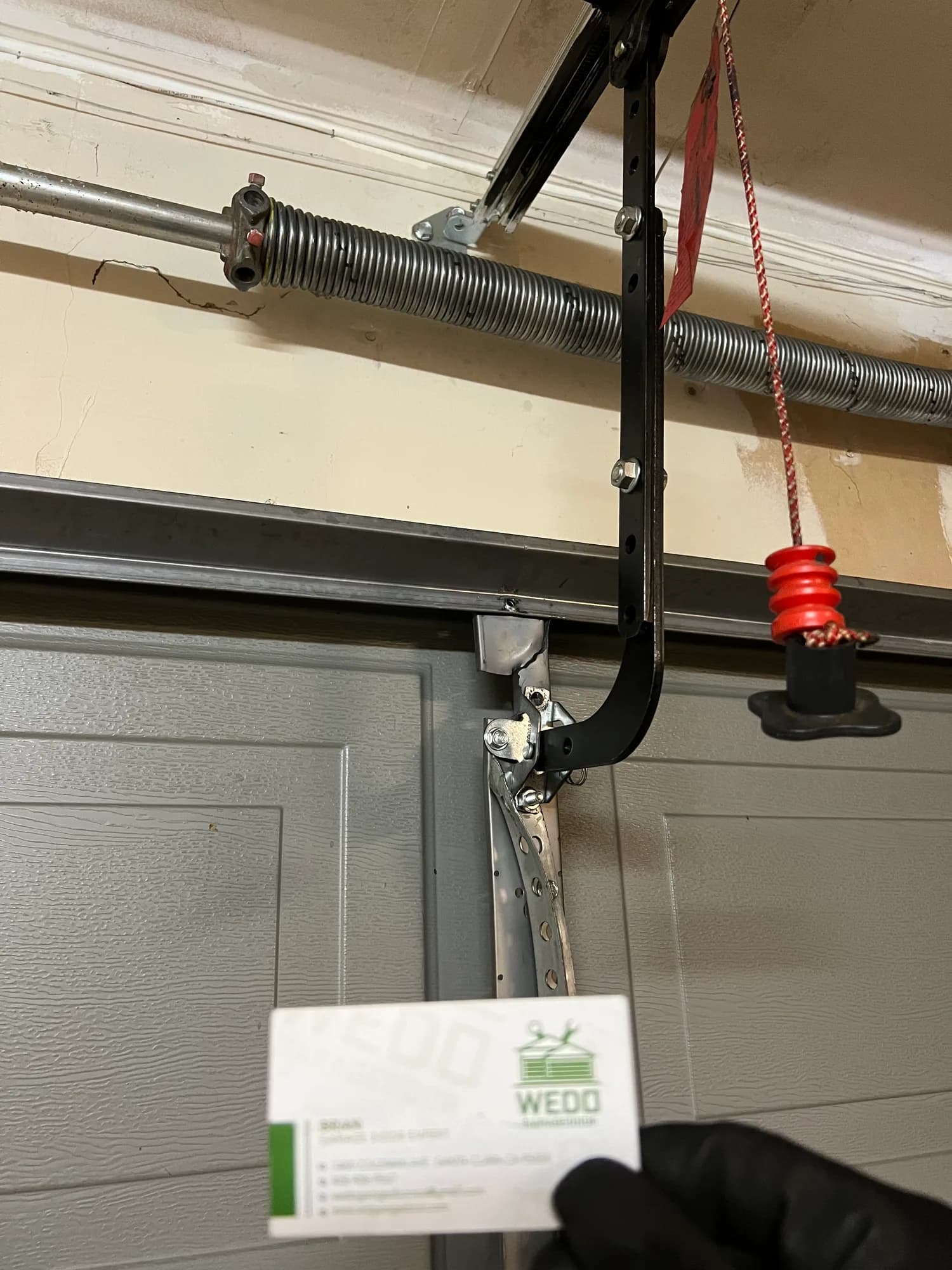 Completed garage door opener installation on a clean ceiling