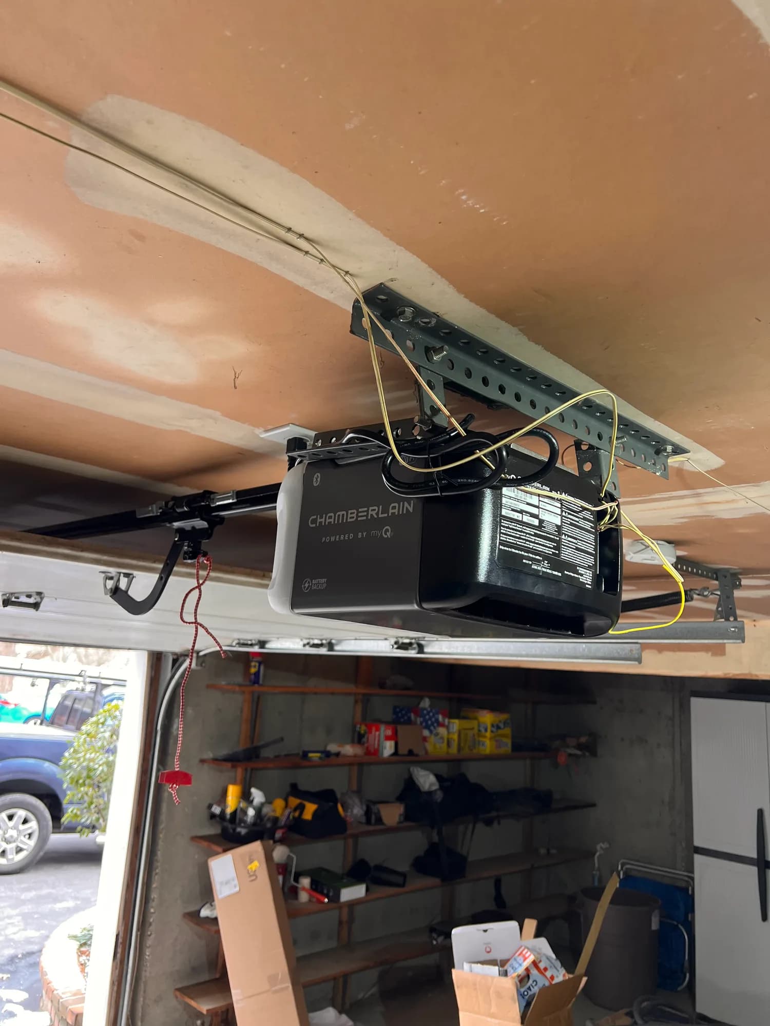 Genie garage door opener installed on a garage ceiling