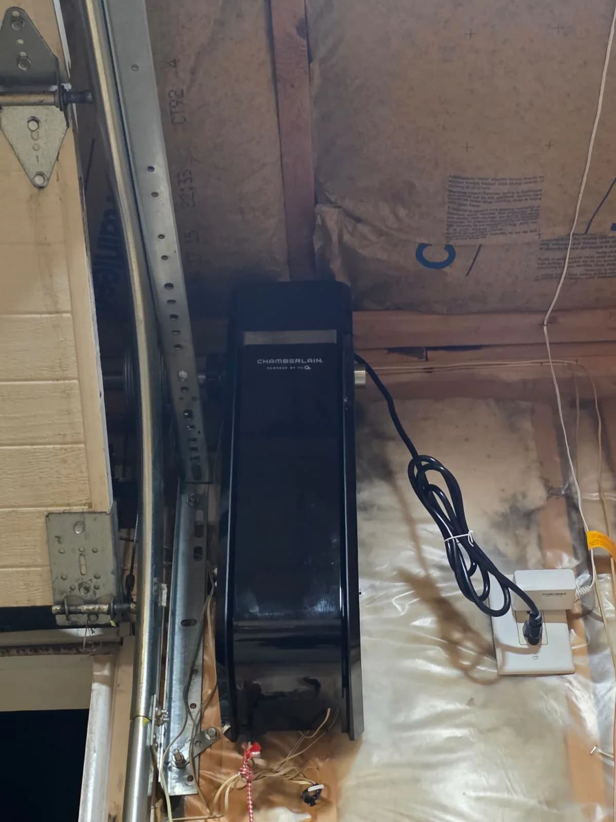 Torsion spring and cable drum on a residential garage door