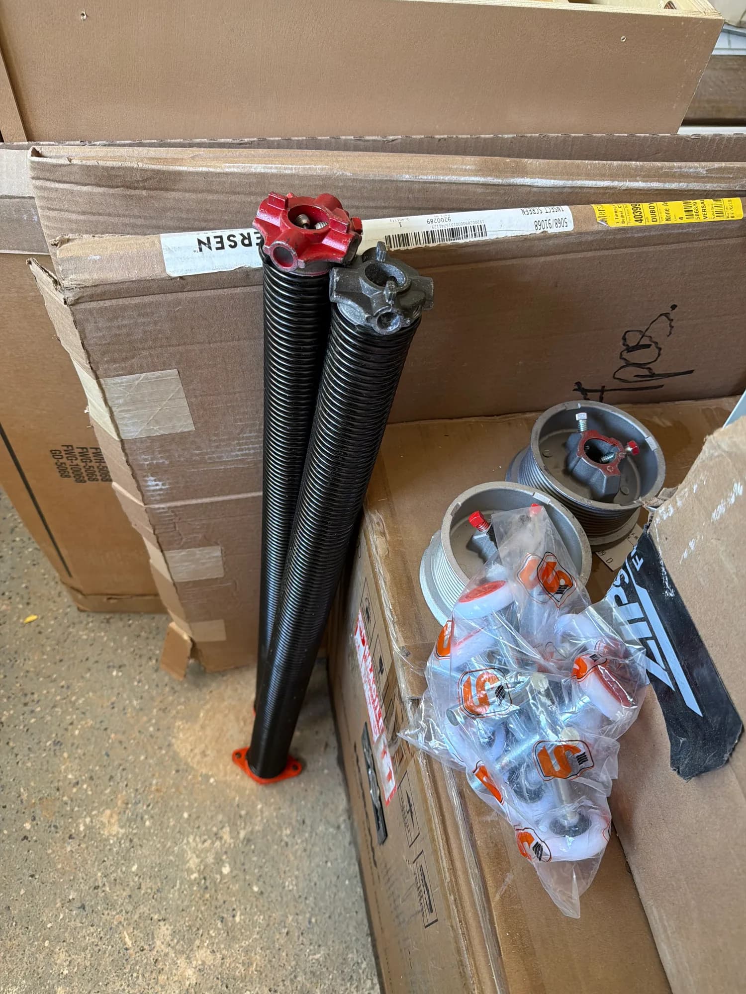 New torsion springs installed on a residential garage door shaft