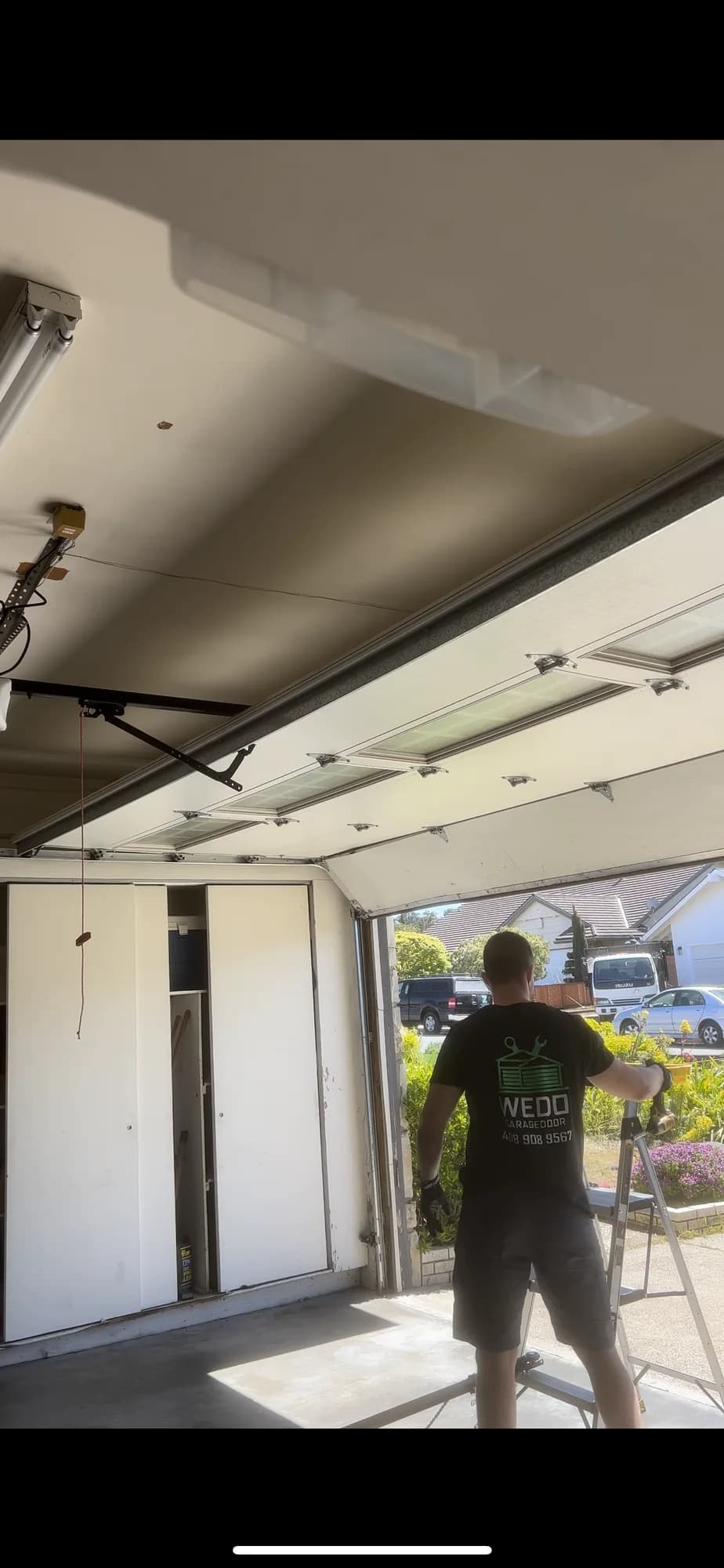 Open garage door during a neighborhood service call