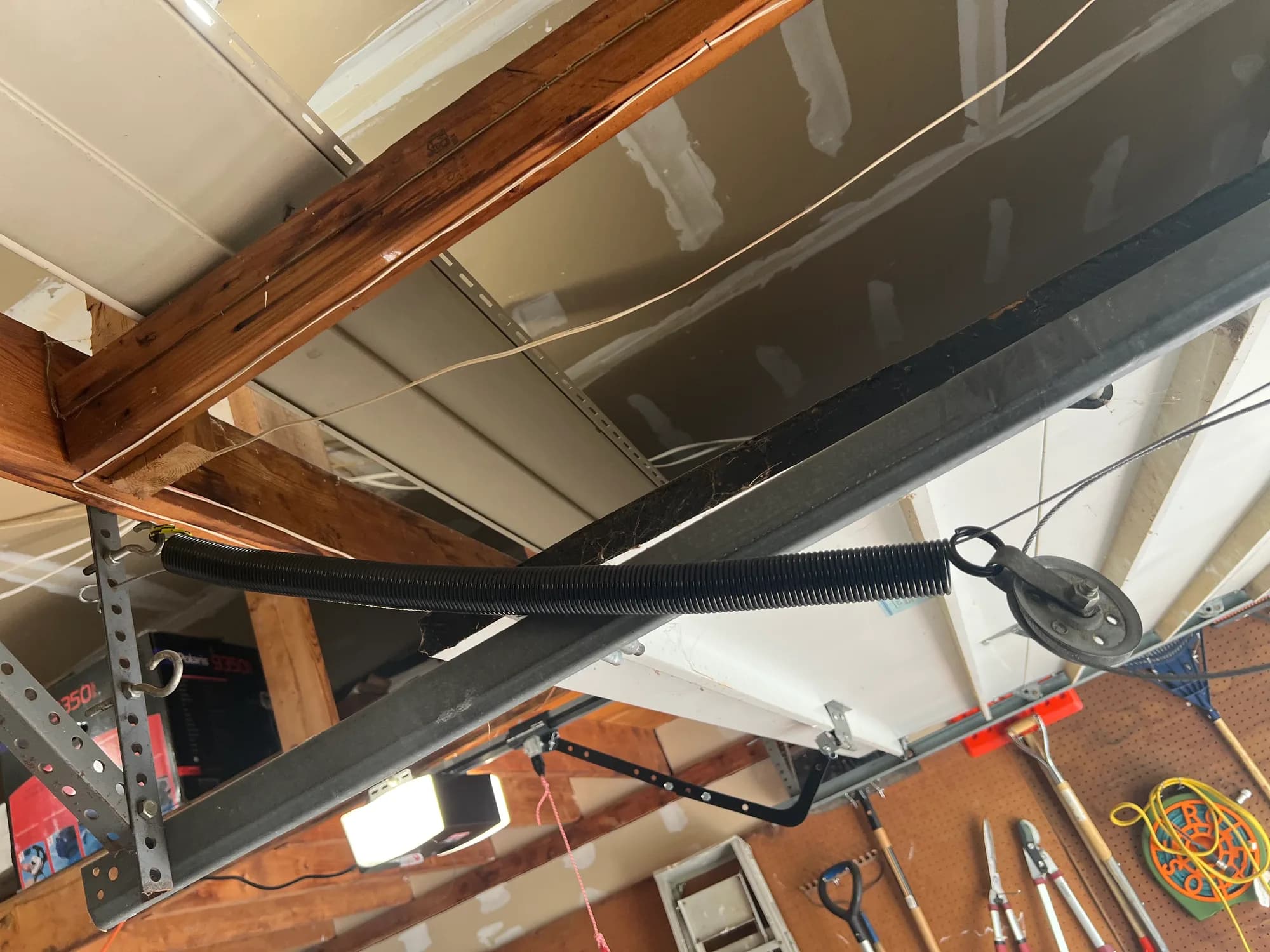 Garage door roller seated in the track