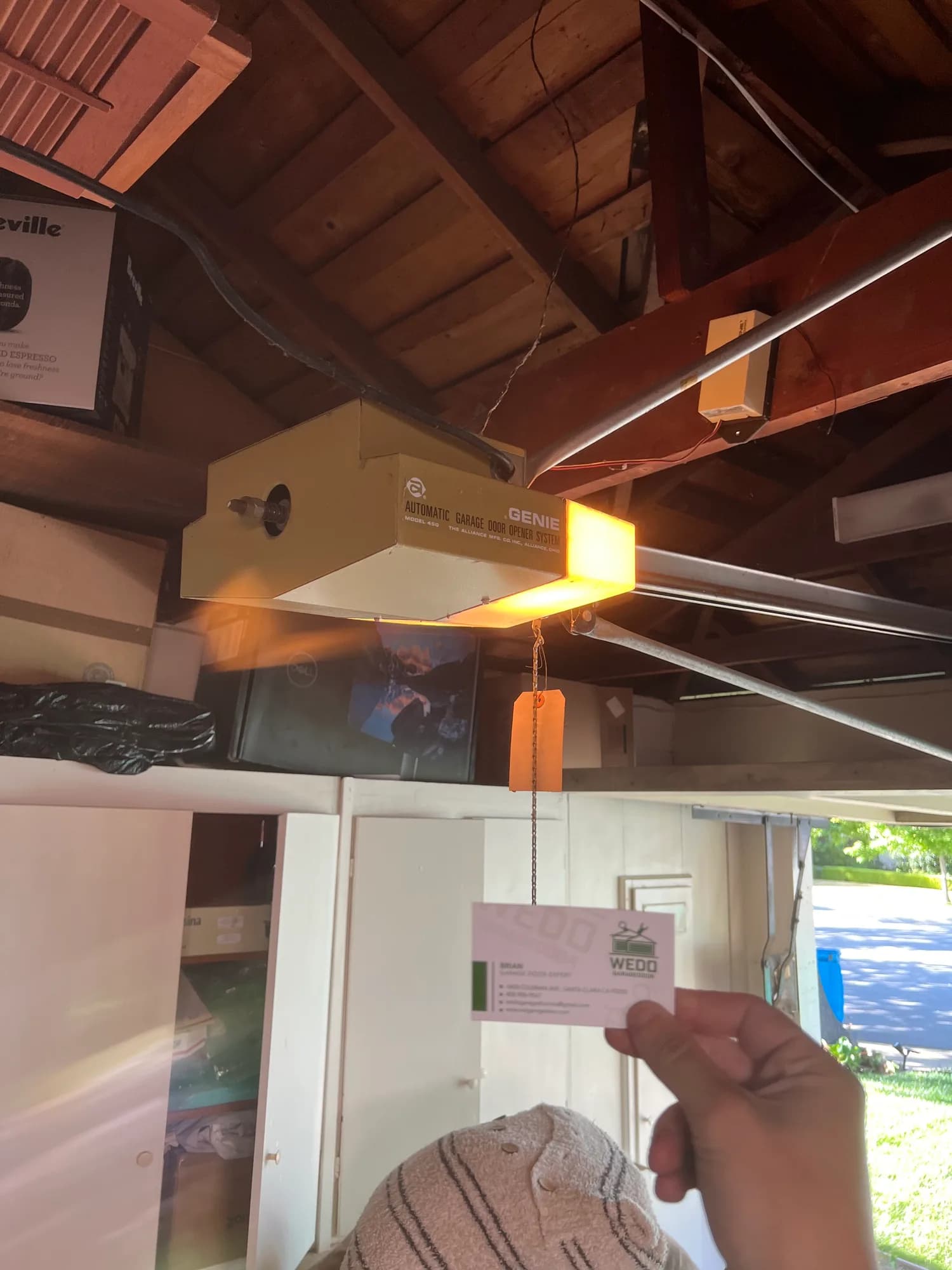 Garage door track being aligned during an off-track repair