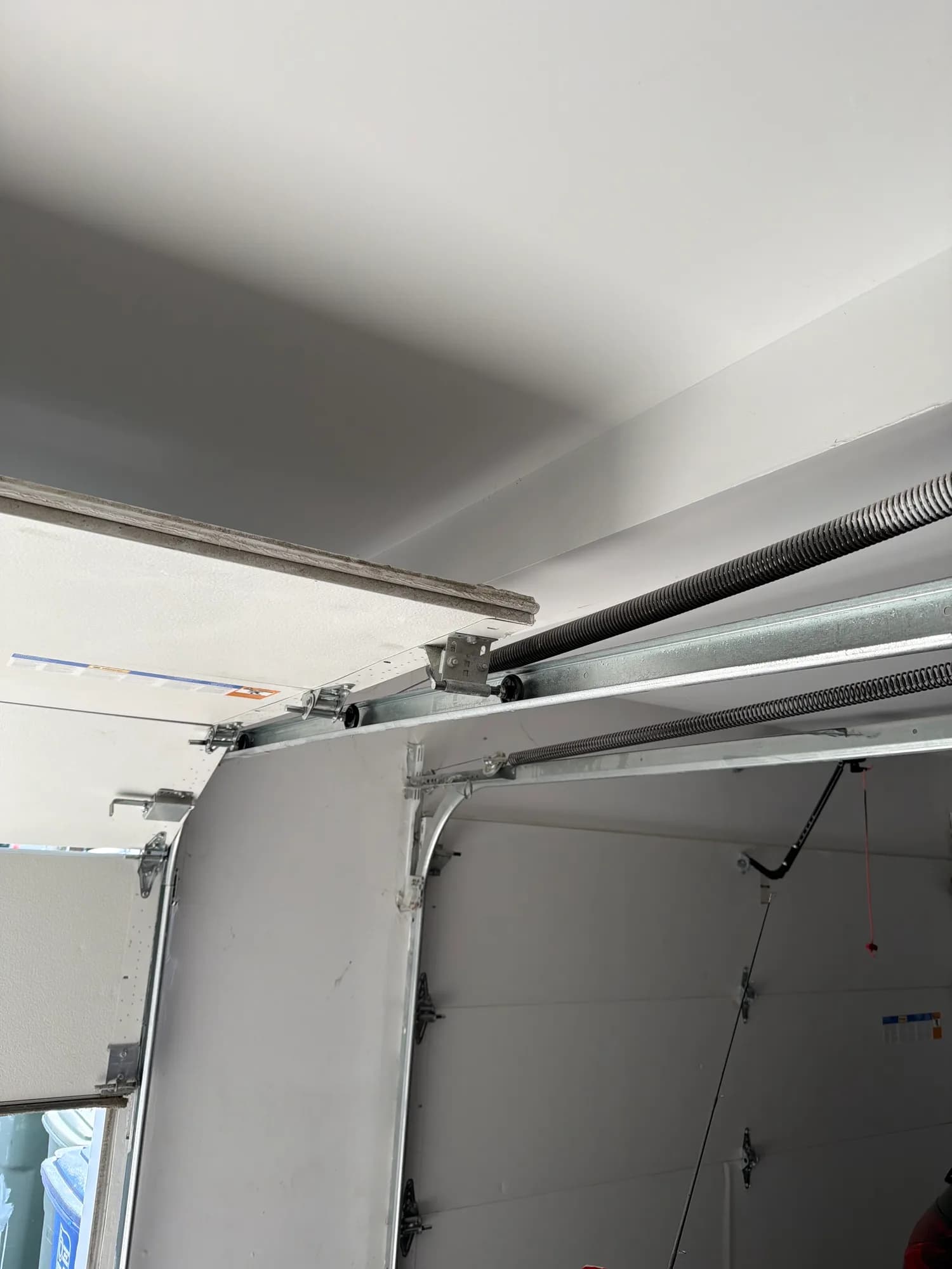 Garage door track and rollers after an alignment