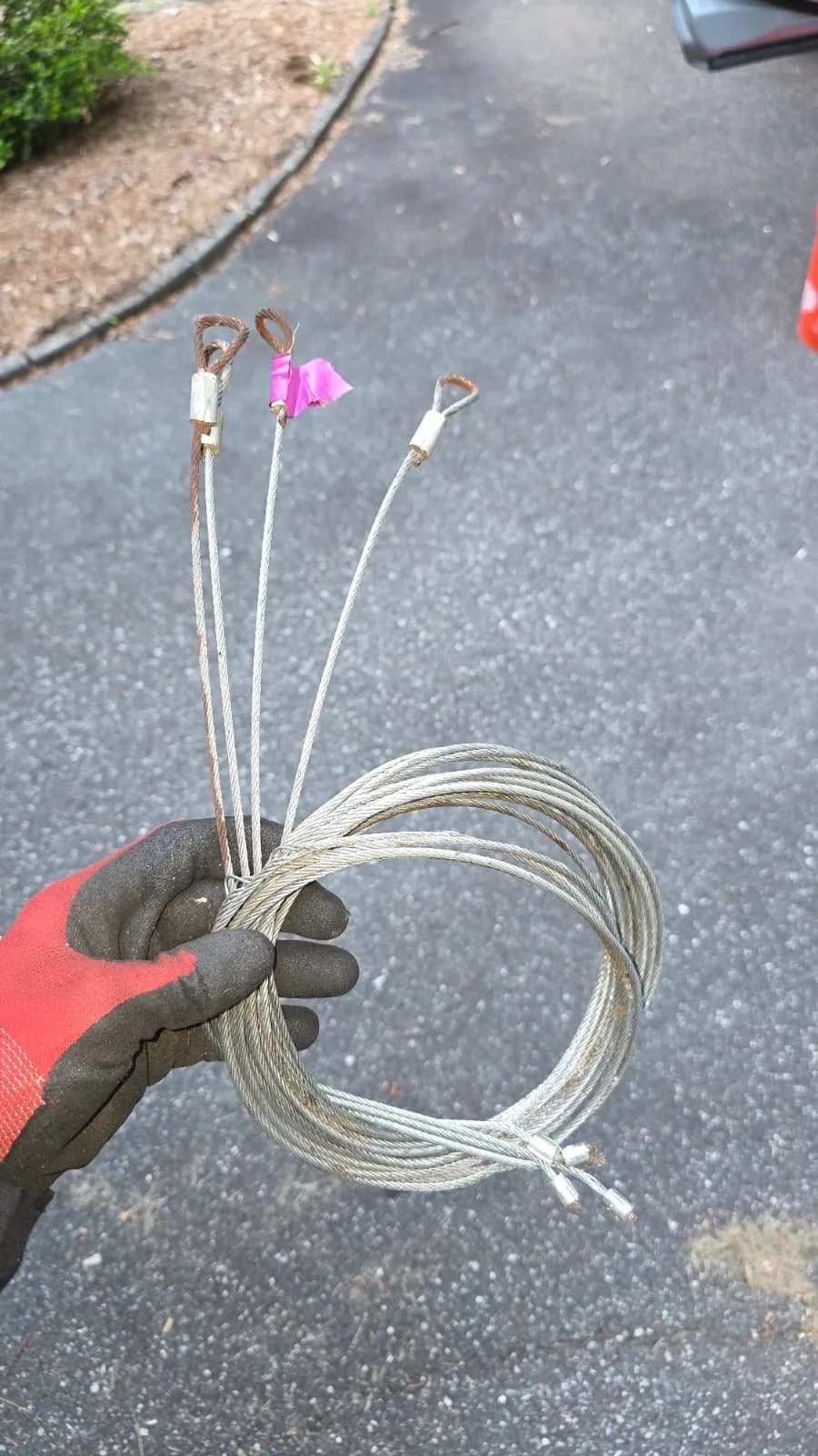 Garage door lift cables on a torsion drum